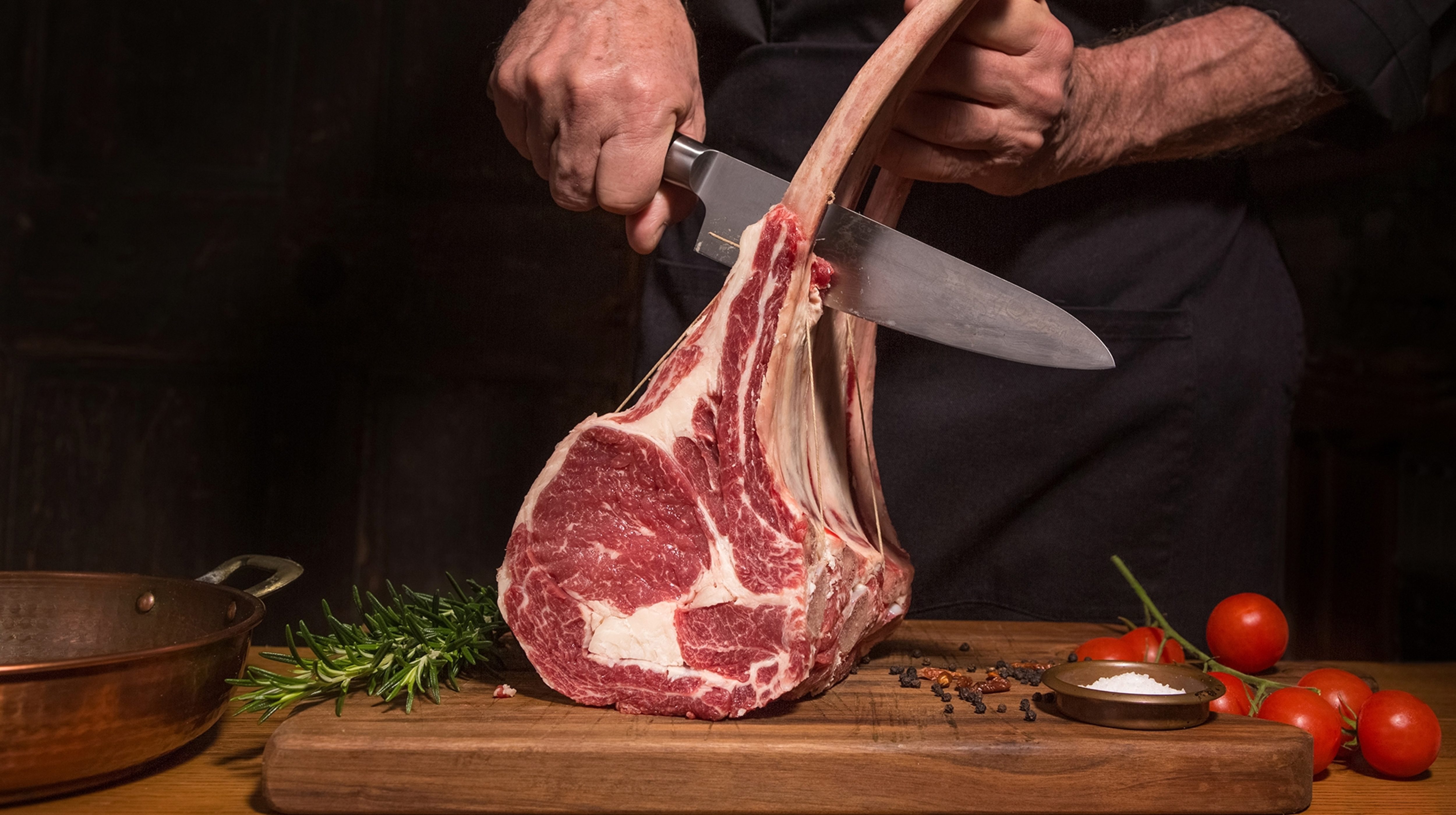 Chef cutting rack of chops