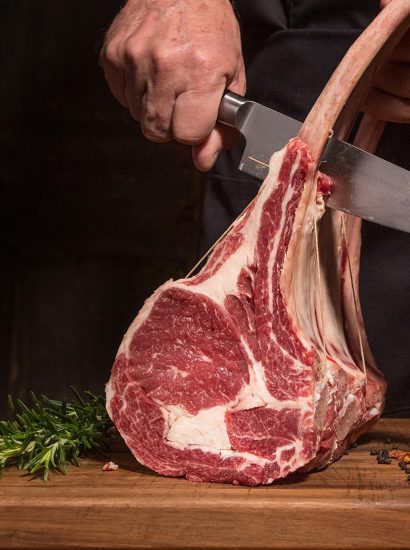 Chef cutting rack of chops